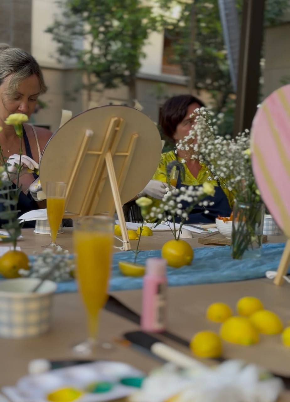 Paints and easels set out for a workshop