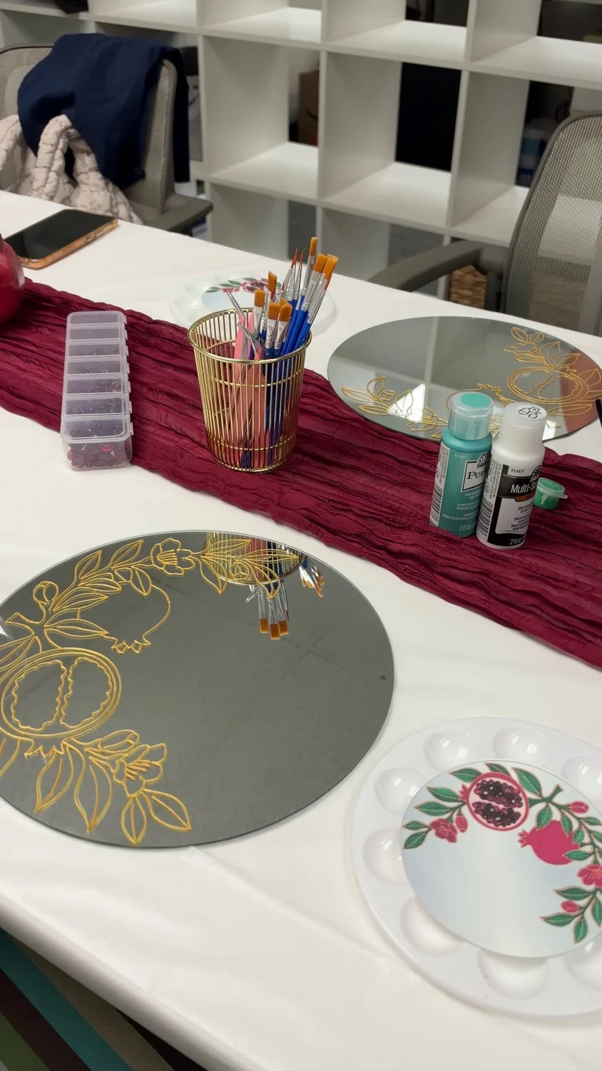 Gold outlines and materials prepared for the pomegranate workshop